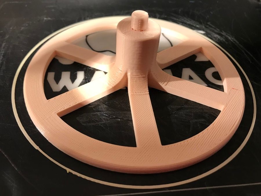 The base printed but not yet removed from the build plate